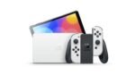 Nintendo Switch (OLED-Modell) mit Dockingstation und weißen Joy-Con-Controllern – Image 2