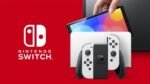 Nintendo Switch (OLED-Modell) mit Dockingstation und weißen Joy-Con-Controllern – Image 3